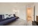 Spare bedroom featuring a futon, closet, carpeted floors, and a ceiling light at 2845 Copper Wind Ln # 4, Las Vegas, NV 89183