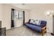 Spare bedroom with carpeted floors, a futon, and natural lighting at 2845 Copper Wind Ln # 4, Las Vegas, NV 89183