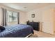 Comfortable bedroom with a plush carpet, dresser, and a bright window at 2845 Copper Wind Ln # 4, Las Vegas, NV 89183