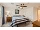 Comfortable bedroom featuring carpeted floors, a ceiling fan, and natural lighting at 2845 Copper Wind Ln # 4, Las Vegas, NV 89183