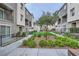 Beautifully landscaped community courtyard with walkways and manicured green spaces at 2845 Copper Wind Ln # 4, Las Vegas, NV 89183