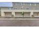 A row of garage doors with modern design enhance the property's curb appeal at 2845 Copper Wind Ln # 4, Las Vegas, NV 89183