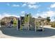 Outdoor playground with slides and climbing structure is surrounded by green space and picnic area at 2845 Copper Wind Ln # 4, Las Vegas, NV 89183