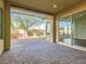 Covered patio area with pavers and large sliding glass doors to the home at 3008 Barrett Springs Ave, Henderson, NV 89044