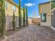 Manicured backyard with lush greenery, mature landscaping, and a paved patio at 3008 Barrett Springs Ave, Henderson, NV 89044