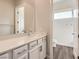 Bright bathroom featuring a white vanity, modern fixtures, and a separate toilet area at 3008 Barrett Springs Ave, Henderson, NV 89044