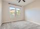 Comfortable bedroom with plush carpeting, bright windows, and neutral colors offering a relaxing space at 3008 Barrett Springs Ave, Henderson, NV 89044