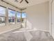 Sunlit bedroom with plush carpeting, large windows, and neutral wall colors at 3008 Barrett Springs Ave, Henderson, NV 89044