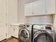 Well-equipped laundry room with stainless steel washer and dryer and ample storage space at 3008 Barrett Springs Ave, Henderson, NV 89044