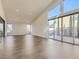 Spacious living room with high ceilings, hardwood floors, recessed lights, and sliding glass doors at 3008 Barrett Springs Ave, Henderson, NV 89044