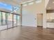 Open floor plan living room with hardwood floors, recessed lights and direct access to the kitchen at 3008 Barrett Springs Ave, Henderson, NV 89044