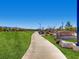 Scenic view of Potenza Park, showcasing walking paths, grassy areas, and community signage at 3008 Barrett Springs Ave, Henderson, NV 89044