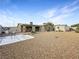 Spacious backyard with gravel landscaping, covered patio, and room for outdoor activities at 4009 Patterson Ave, Las Vegas, NV 89104