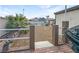 Gravel backyard area partially enclosed with brick borders and a white railing in a fenced yard at 4009 Patterson Ave, Las Vegas, NV 89104
