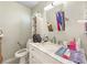 Bathroom with white vanity, marble countertop, mirror, and toilet at 4009 Patterson Ave, Las Vegas, NV 89104