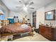 Bedroom featuring a ceiling fan, closet, and window offering natural light at 4009 Patterson Ave, Las Vegas, NV 89104