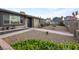 Well-kept front yard featuring drought-resistant landscaping and a charming garden wall at 4009 Patterson Ave, Las Vegas, NV 89104