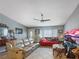 Inviting living room featuring tile floors, a ceiling fan, and large windows at 4009 Patterson Ave, Las Vegas, NV 89104