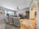 Living room with tile floors, ceiling fan, large window, and neutral-colored walls at 4009 Patterson Ave, Las Vegas, NV 89104