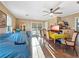 Bright, airy living room with wood floors, ceiling fan, and sliding glass doors to the backyard at 4009 Patterson Ave, Las Vegas, NV 89104