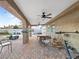 Spacious covered patio with brick flooring, ceiling fans, and ample seating area at 4009 Patterson Ave, Las Vegas, NV 89104
