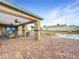 Spacious covered patio with brick flooring, ceiling fans, and ample space for outdoor entertaining at 4009 Patterson Ave, Las Vegas, NV 89104