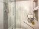 Contemporary shower featuring glass door, sleek fixtures, and modern tile design at 4009 Patterson Ave, Las Vegas, NV 89104