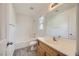 Clean bathroom with tub-shower combo, wood-look floors, and large mirror at 4045 Oliver Sagebrush Dr, Las Vegas, NV 89122