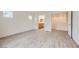 Spacious bedroom features two windows and doorway to bathroom at 4045 Oliver Sagebrush Dr, Las Vegas, NV 89122