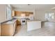 Bright eat-in kitchen features wood cabinetry, white appliances, and a center island at 4045 Oliver Sagebrush Dr, Las Vegas, NV 89122
