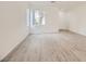 Bright living room boasting natural light, wood-look flooring, and a spacious layout, creating an inviting atmosphere at 4045 Oliver Sagebrush Dr, Las Vegas, NV 89122
