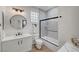 Contemporary bathroom with a glass-enclosed shower, a decorative mirror, and stylish vanity at 4379 Bella Cascada St, Las Vegas, NV 89135