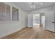 The bedroom has a light and airy feel with wood floors, large windows, and a modern ceiling fan at 4379 Bella Cascada St, Las Vegas, NV 89135