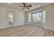 Bright bedroom with a ceiling fan, large windows, and an outdoor patio at 4379 Bella Cascada St, Las Vegas, NV 89135
