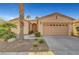 Beautiful single-story home featuring desert landscaping, a two-car garage, and a covered front porch at 4379 Bella Cascada St, Las Vegas, NV 89135