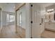 Hallway with tile flooring leading to the primary bedroom and the primary bathroom at 4379 Bella Cascada St, Las Vegas, NV 89135