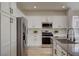 Modern kitchen featuring stainless steel appliances, sleek countertops, and ample cabinet space at 4379 Bella Cascada St, Las Vegas, NV 89135