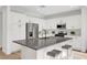 Modern kitchen with white cabinets, stainless steel appliances, and large center island with seating at 4379 Bella Cascada St, Las Vegas, NV 89135