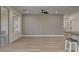 Open living space with light wood floors, neutral walls, and views of the backyard at 4379 Bella Cascada St, Las Vegas, NV 89135