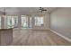 Living area with wood floors, a kitchen island, and a view of the backyard at 4379 Bella Cascada St, Las Vegas, NV 89135