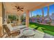 Inviting covered patio with ceiling fan, ideal for relaxing and entertaining outdoors at 4379 Bella Cascada St, Las Vegas, NV 89135