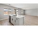 Kitchen island with marble countertop, stainless steel sink, and views into the spacious living area at 4405 Pioche Ave, North Las Vegas, NV 89032