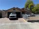 Cozy single-story home with an attached garage and gated front yard at 4923 Arizona Ave, Las Vegas, NV 89104