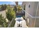 Private backyard oasis with plunge pool, stylish patio furniture under an umbrella, and verdant landscaping for outdoor enjoyment at 5096 Thunder River Cir, Las Vegas, NV 89148