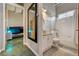 Bright bathroom with vanity, modern glass sink, and bathtub shower providing a clean and refreshing space at 5096 Thunder River Cir, Las Vegas, NV 89148