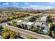 Street view of stylish homes featuring oversized windows, private plunge pools, and lush landscaping in a desirable neighborhood at 5096 Thunder River Cir, Las Vegas, NV 89148