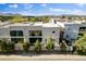 An elevated view of the property, featuring large windows and mature trees, set in a residential neighborhood at 5096 Thunder River Cir, Las Vegas, NV 89148