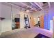 Home gym showcasing multiple doors, equipment and access to other rooms at 5096 Thunder River Cir, Las Vegas, NV 89148
