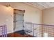 Hallway with stairs leading to a gym that features an industrial metal door at 5096 Thunder River Cir, Las Vegas, NV 89148