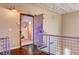 Hallway with stairs leading to a gym that features an industrial metal door at 5096 Thunder River Cir, Las Vegas, NV 89148